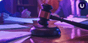 A gavel striking a sound block on a desk strewn with papers