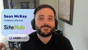 A man with headphones participating in a video call, identified as Sean McKay, President of Site Hub, with the logos of Site Hub and UserWay visible on the screen.