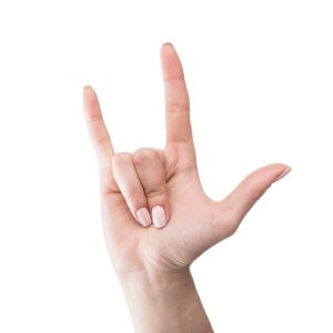 mão sinalizando eu te amo em Linguagem Brasileira de sinais.