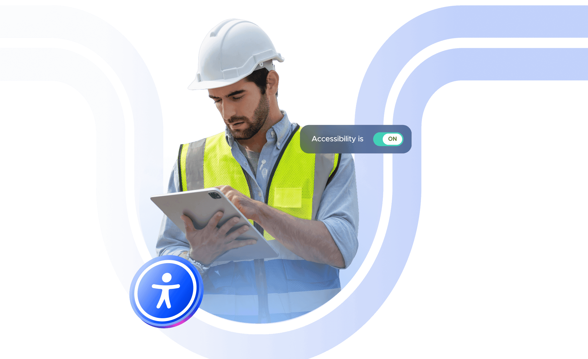 A white man wearing a hard hat and using a tablet
